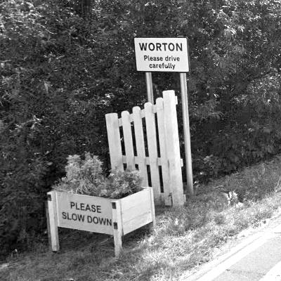 Road signs entering Worton, Wiltshire