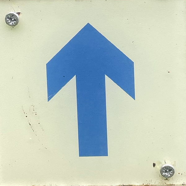 Blue arrow on white background