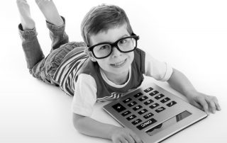 Boy with an oversize calculator