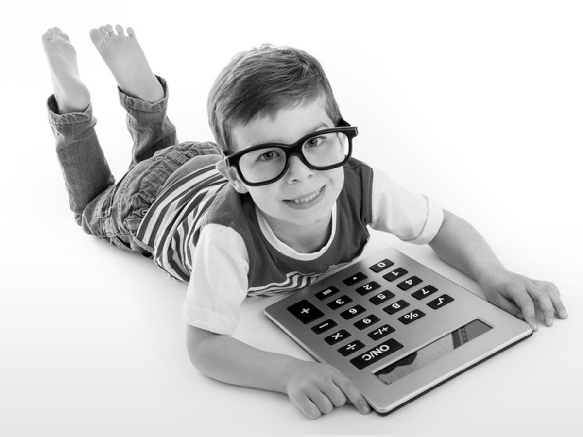 Boy with an oversize calculator