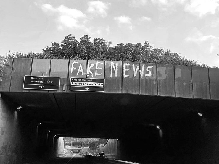 'Fake News' graffiti on a bridge parapet
