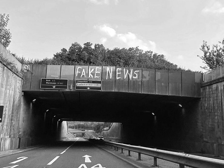 'Fake News' graffiti on a bridge parapet