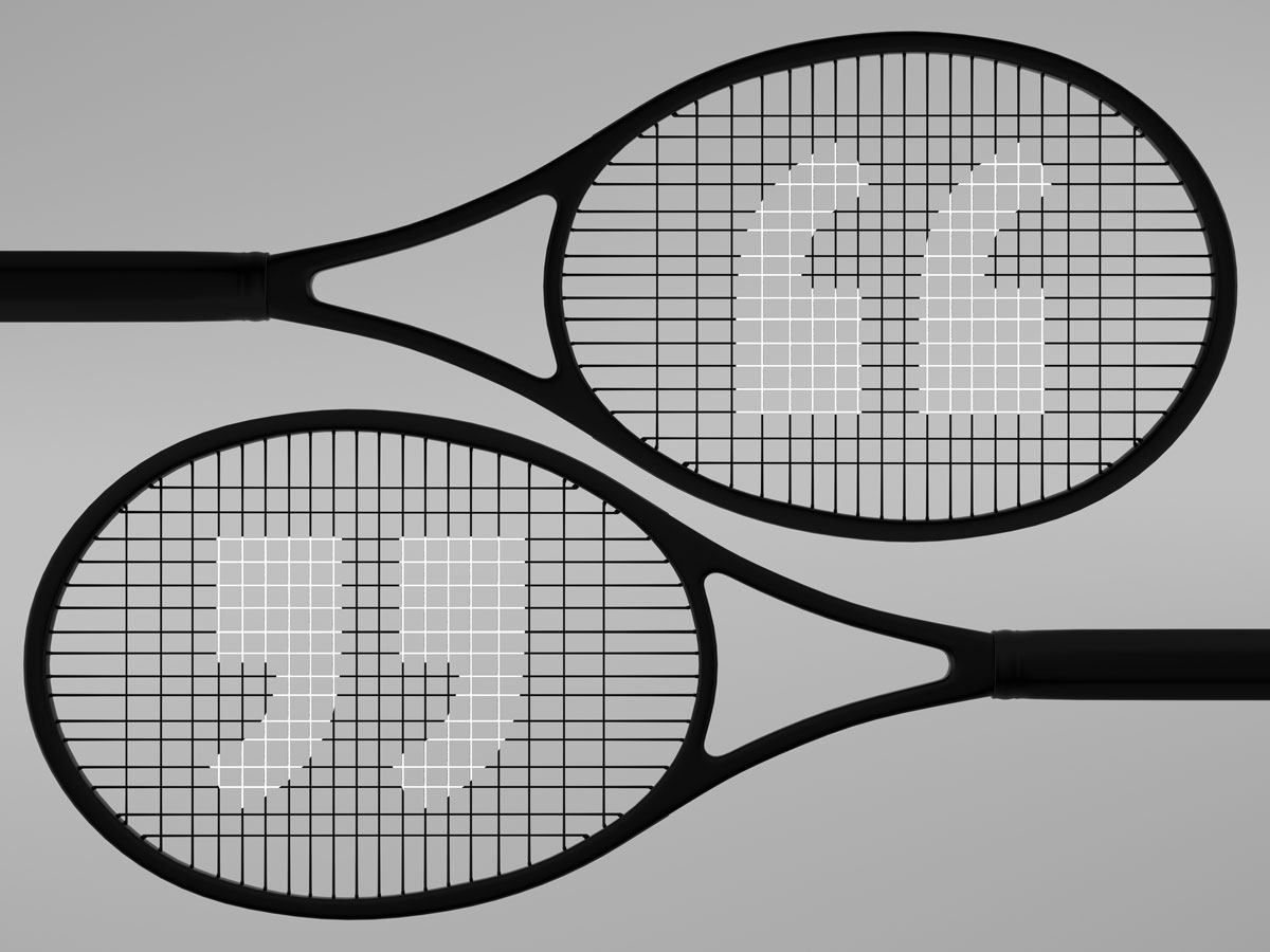 Pair of tennis rackets with quote mark motif on their strings