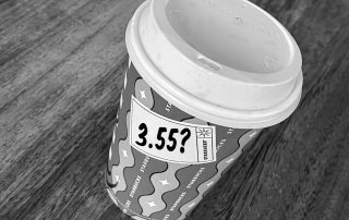 Starbucks coffee cup with £3.55 price tag