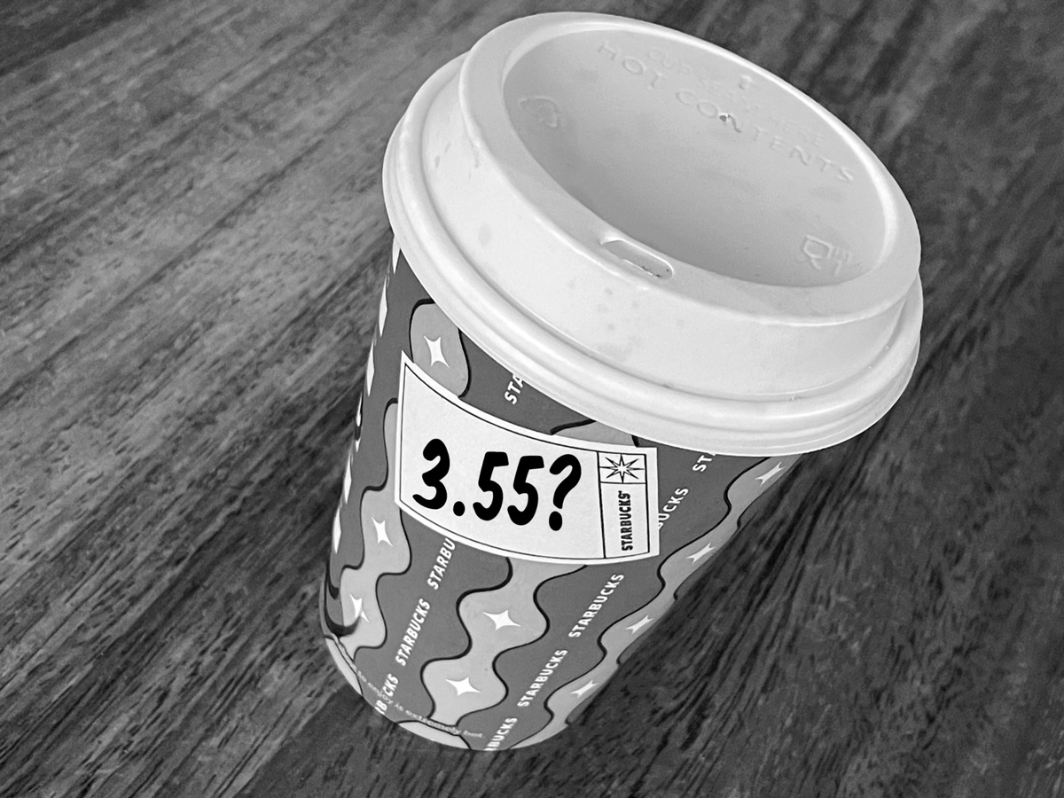 Starbucks coffee cup with £3.55 price tag