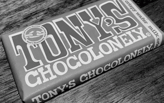 Bar of Tony's Chocolonely chocolate with it's irregular-spaped chunks.