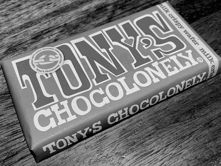 Bar of Tony's Chocolonely chocolate with it's irregular-spaped chunks.