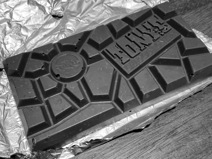 Bar of Tony's Chocolonely chocolate with it's irregular-spaped chunks.